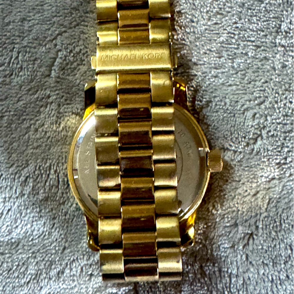 Michael Kors Gold-Tone Bracelet Watch
4 MK watches.